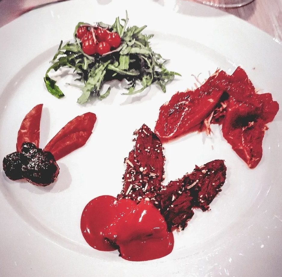 Image of the plate showing the food being described (duck, goose and puffin)