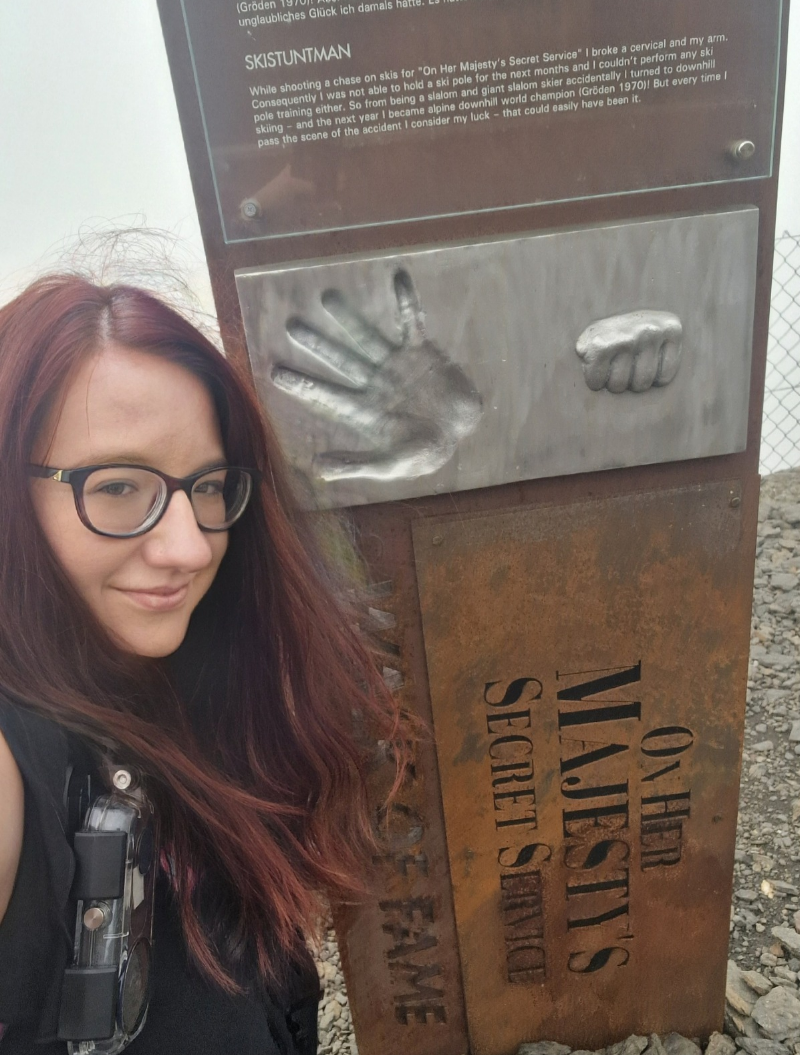 Myself posing next to one of the Bond World "On Her Majesty's Secret Service" Walk of Fame posts. This post has a palm print and a fist print from the stuntsman from the movie.